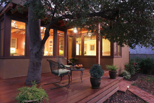 Exterior deck which extends the living space to the outside garden.  The oak tree was preserved and adds a dramatic element to the deck.