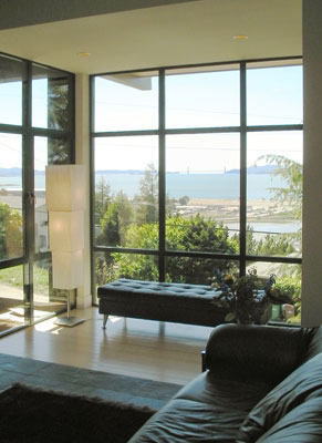 Family Room with floor to ceiling glass overlooking the San Francisco Bay and Golden Gate Bridge