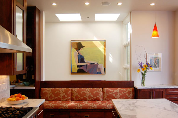 view from the new kitchen into the skylit stairwell.  Built-in seating at the kitchen.