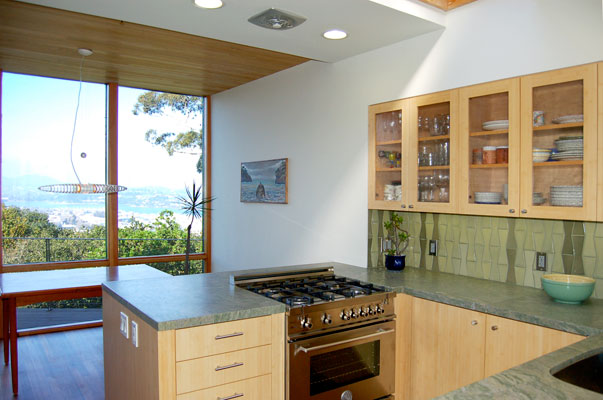 View from kitchen overlooking Sausalito.  New floor to ceiling windows, a rebuilt deck and a kitchen mirror wall emphasize the stunning views stretching from Richardson bay up to nearby Mount Tamalpais.