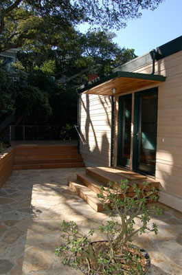 Exterior showing new entry and wood siding