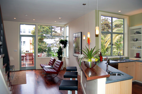 View of family room from kitchen, with direct access to a dining terrace and the rear yard.